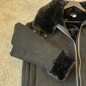 black suede jacket, with silver zipper details